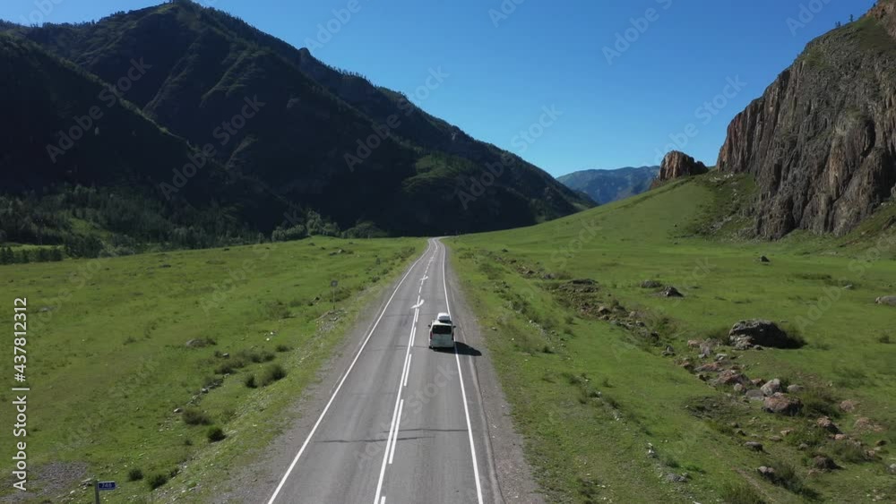 Car driving on mountain road.  Drone view from height of  stunning beautiful gorge