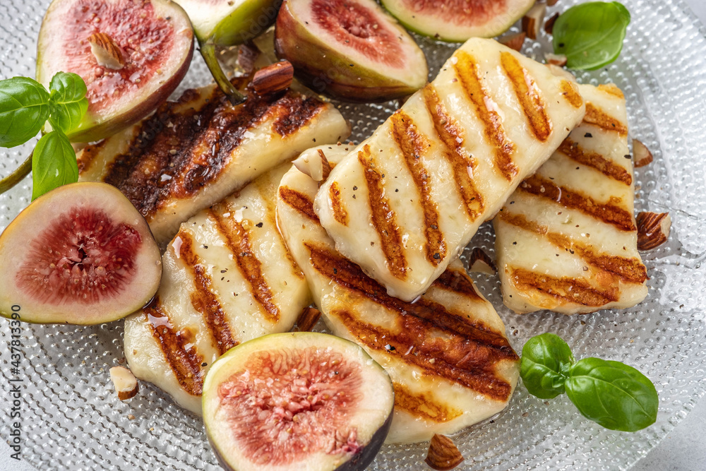 Grilled Halloumi Cheese, fresh figs fruit, almonds and honey Grilled Halloumi Cheese, fresh figs fruit, almonds and honey