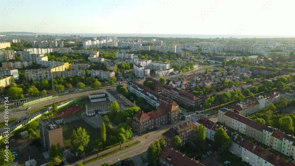 Aerial view of modern and old districts of Gdansk city in summer on sunrise, traffic on the speedway of Poland, clean green streets and city panorama Aerial view of modern and old districts of Gdansk city in summer on sunrise, traffic on the speedway of Poland, clean green streets and city panorama