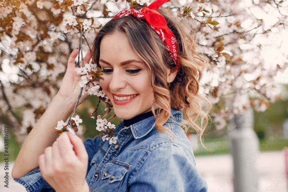 Fototapeta premium Elegant and stylish girl in a spring park