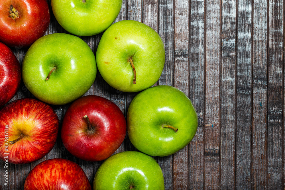 Fresh red and green apples on wooden background. Top view. Fresh red and green apples on wooden background. Top view.