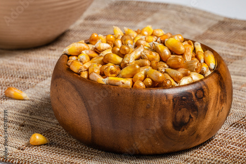 Peruvian Snacks. Fried Corn Seeds in Wooden Bowl.