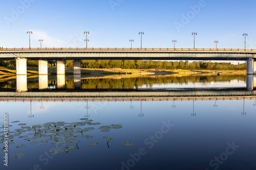 Fototapeta Bridge and it's reflection in still water of the River Ishim