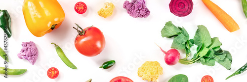 Healthy food panorama with copy space. Various fresh vegetables, shot from the top on a white background