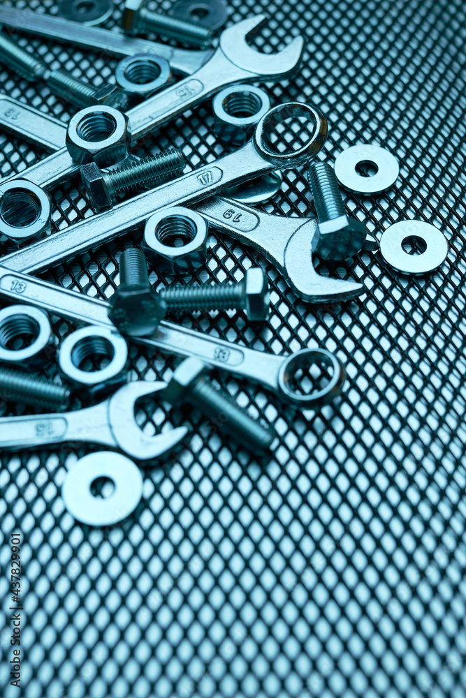 Fototapeta premium Set of chrome wrenches on steel surface. Mechanic tools for maintenance. Hardware tools to fix