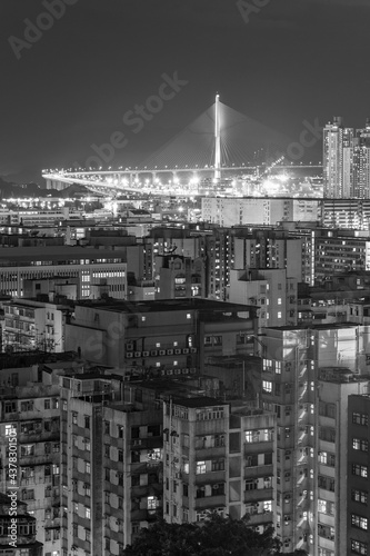 Bridge and high rise building in Hong Kong city at night