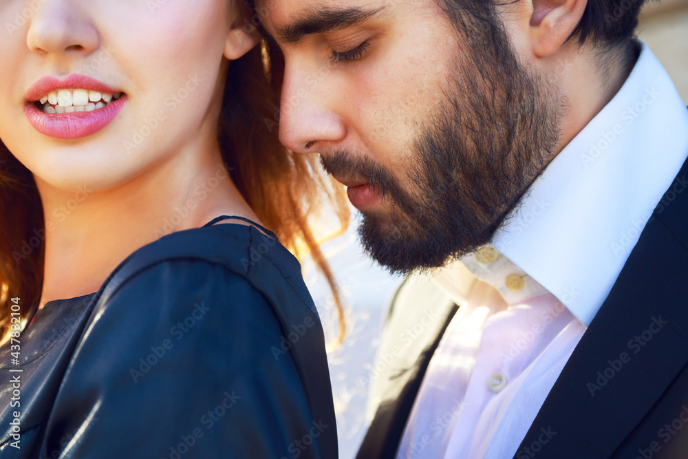 Fashion image of young blonde woman posing with her boyfriend Fashion image of young blonde woman posing with her boyfriend