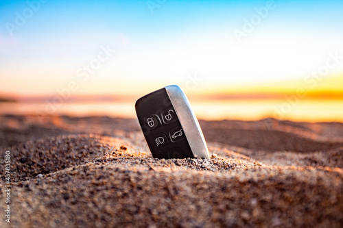 car key on the beach in the sand