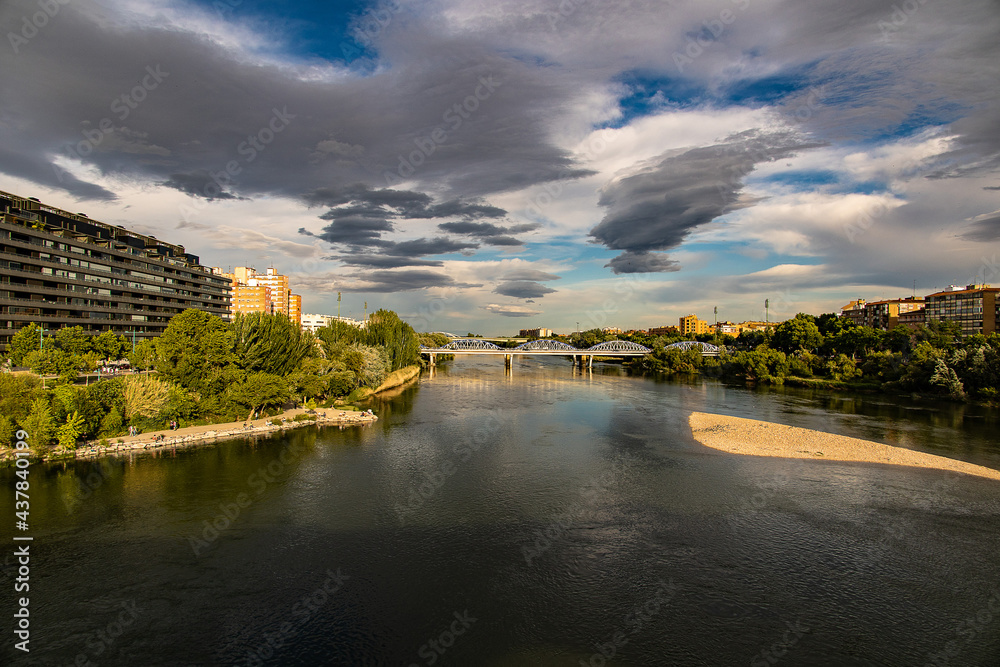 landscape in a spring day over the city bridge and the Ebro river in the Spanish city of Zaragoza