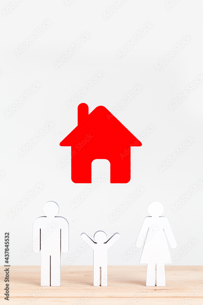 red wooden house model with family figure on white background red wooden house model with family figure on white background