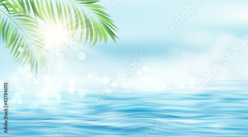 Summer seascape. The rays of the sun and the leaves of the palm tree on the background of the seascape. Sun rays blurred bokeh effect. Vector illustration