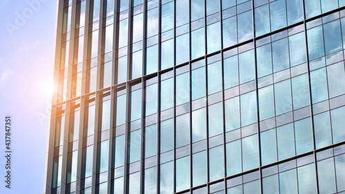 Wallpaper Mural Modern architecture with sun ray. Glass and steel facade on a bright sunny day with sunbeams on the blue sky. Economy, finances, business activity concept. Torontodigital.ca