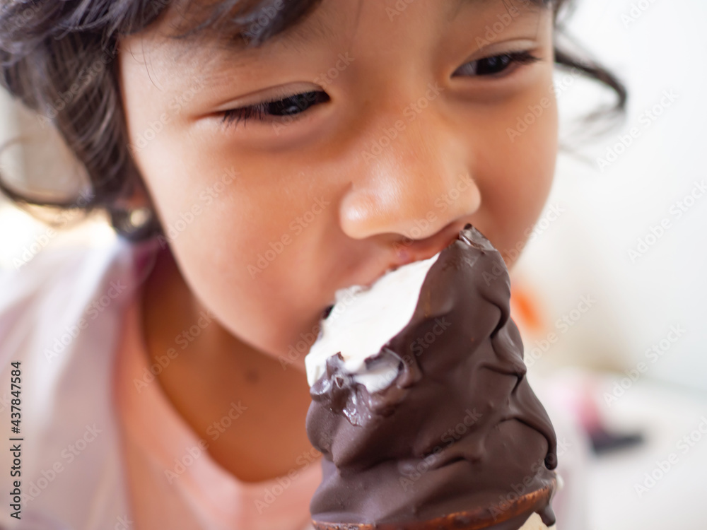 healthy girl smiling and enjoying life. eating icecream. child education and future for kids concept
