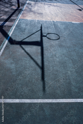 street basketball hoop shadows on the court © Ismael