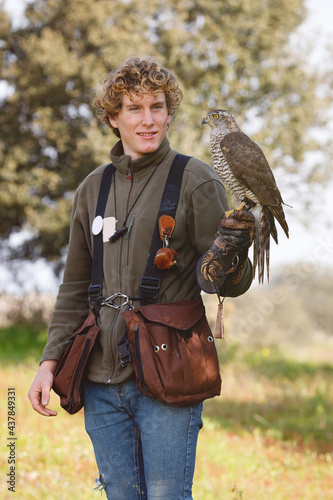 Young guy practicing falconry