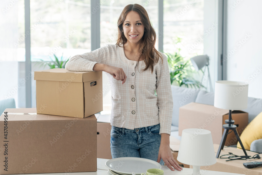 Smiling woman posing in her new home Smiling woman posing in her new home