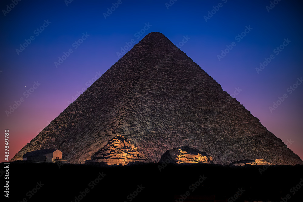 The Great Pyramid of Giza with Queen Pyramids at Night.