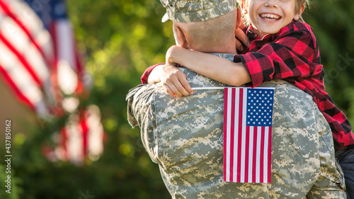 Happy reunion of soldier with family outdoors
