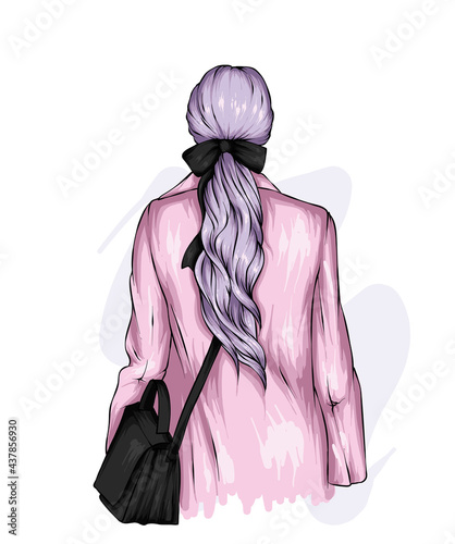 A girl with a stylish hairstyle and a bow. Fashion and style, clothing and accessories.