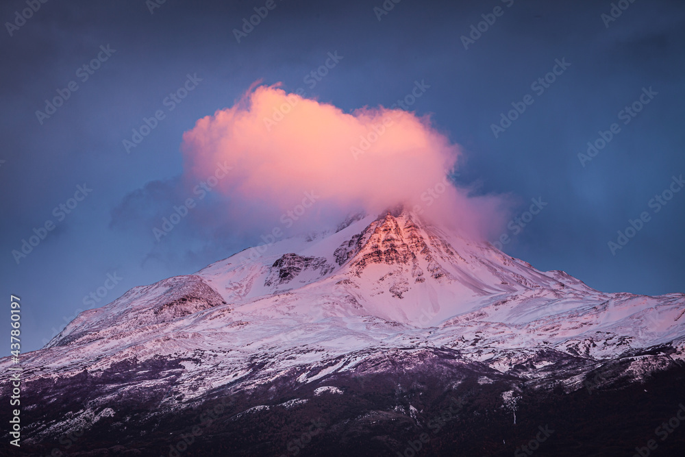 Winter in Patagonia: sunrise over snow covered mountain peak