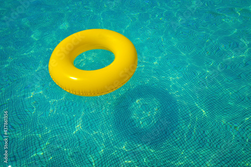 Colorful tube floating in a swimming pool