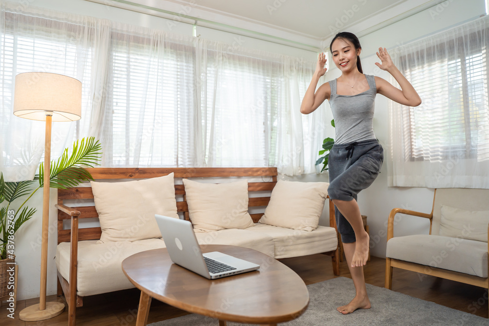 Active sportwoman workout follow virtual exercise online video at home