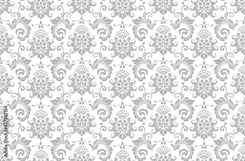Wallpaper in the style of Baroque. Seamless vector background. White and gray floral ornament. Graphic pattern for fabric, wallpaper, packaging. Ornate Damask flower ornament.