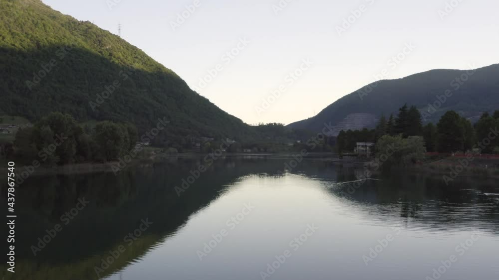 Drone flying over Lake Endine with the mountains in the background,Lombardy,Italy. Drone flying over Lake Endine with the mountains in the background,Lombardy,Italy.