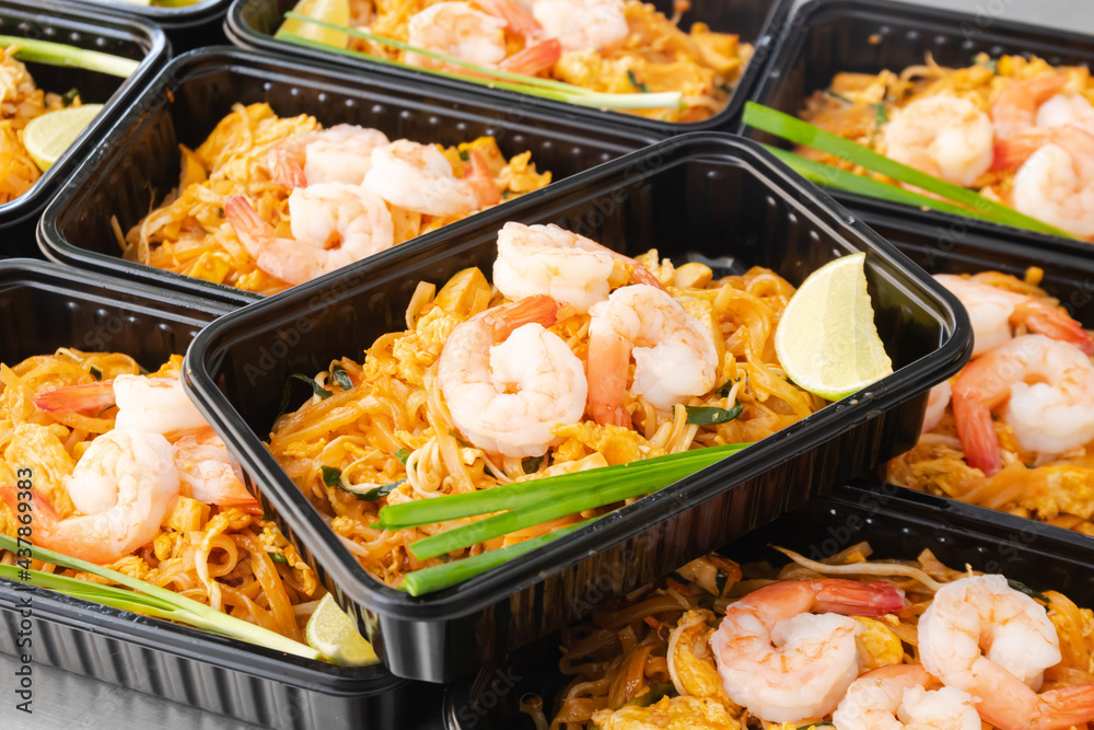 Thai food lunch boxes in plastic packages, Pad Thai Noodles.
