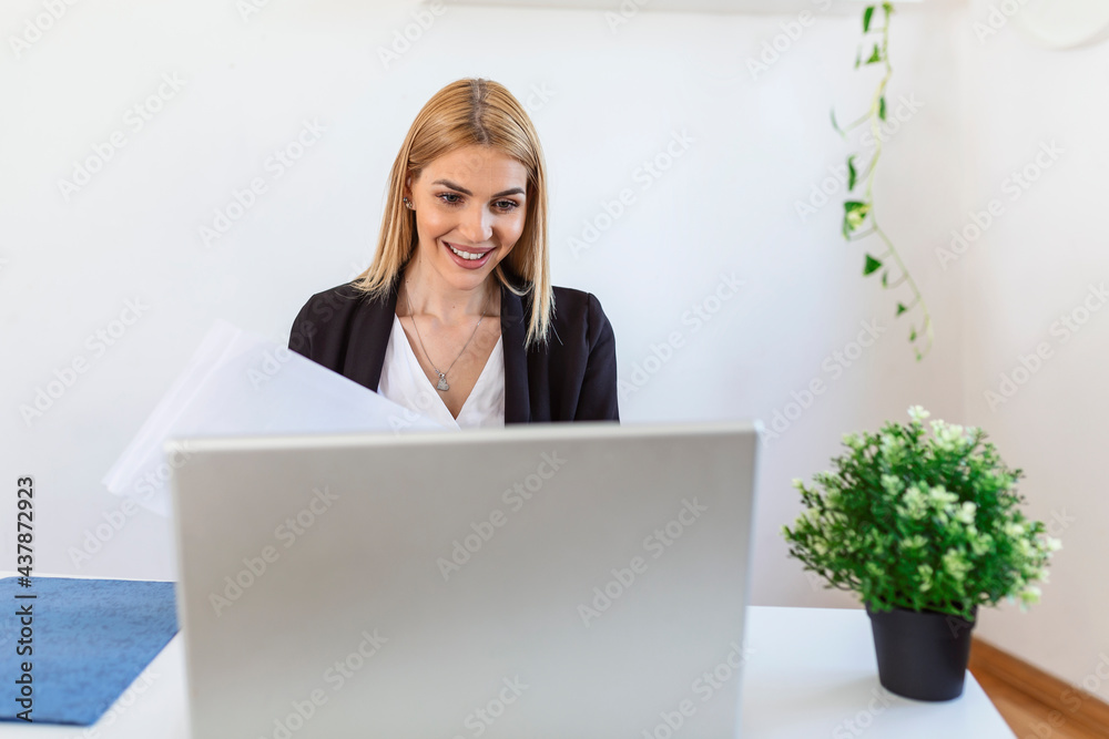 A young woman works remotely on a laptop in her apartment. A lady during a video business briefing at home. A pretty female student listening to an online lecture. A young woman works remotely on a laptop in her apartment. A lady during a video business briefing at home. A pretty female student listening to an online lecture.