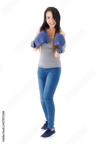 Smiling young woman in boxing gloves
