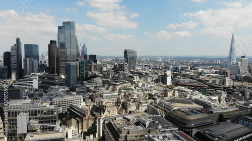 Reverse aerial view of London Financial and Banking district and the Shard on a sunny day photo