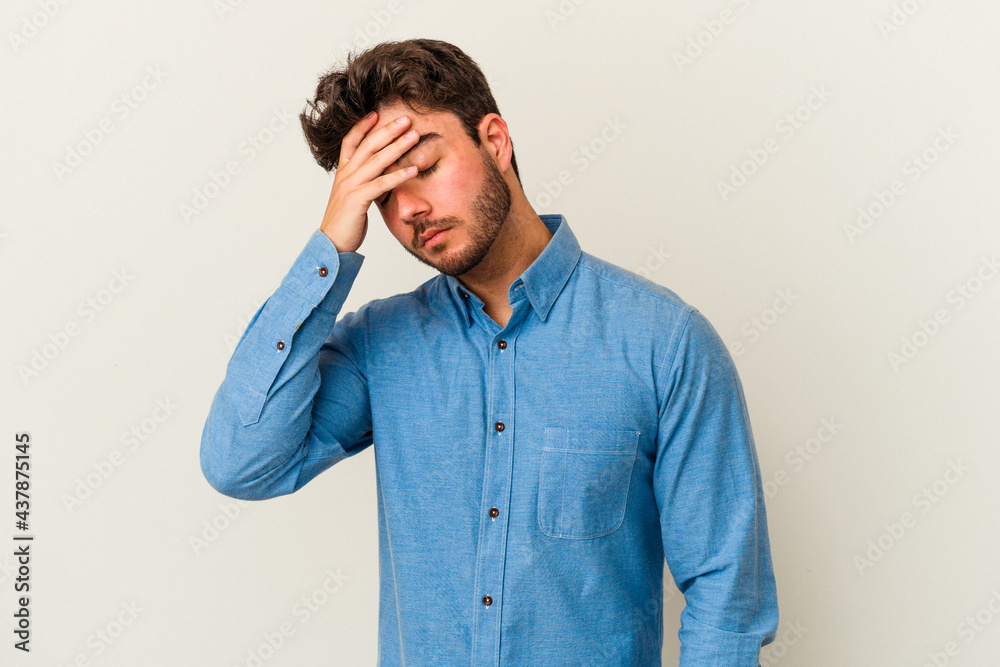 Young caucasian man isolated on white background touching temples and having headache. Young caucasian man isolated on white background touching temples and having headache.