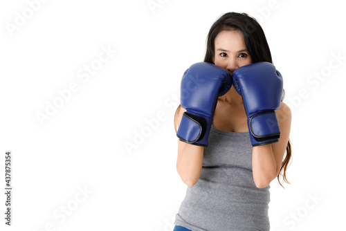 Confident sportive woman in boxing gloves