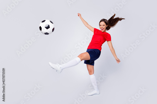 Full size profile photo of crazy lady player soccer team 2020 league final game kicking ball kickoff wear football uniform t-shirt shorts cleats socks isolated white color background