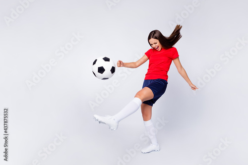 Full body profile photo of crazy lady goalkeeper player soccer team 2020 league game kick ball try hard wear football uniform t-shirt shorts cleats socks isolated white color background © deagreez