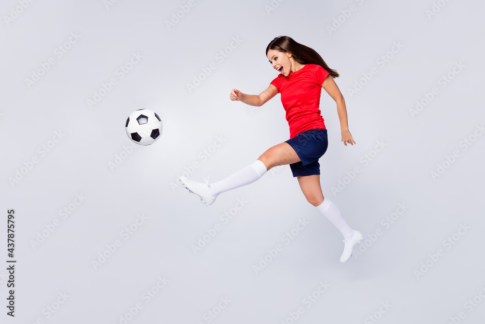 Full length profile photo of crazy air fly joy fun defender soccer team game kick ball jump run pass wear football uniform t-shirt shorts cleats long knee socks isolated white color background