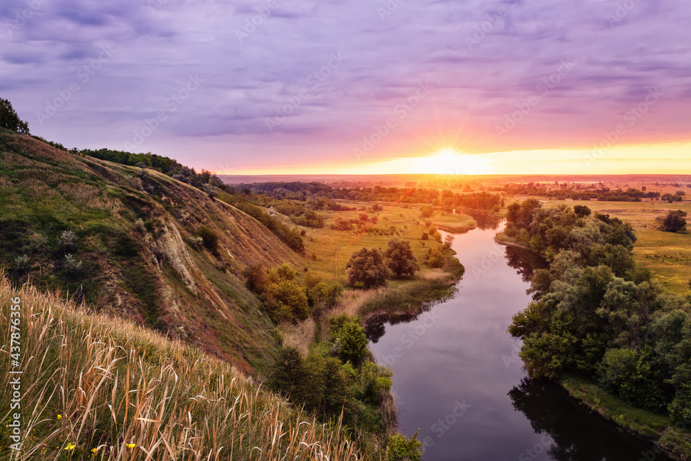 beautiful summer landscape sunrise over river with green meadow