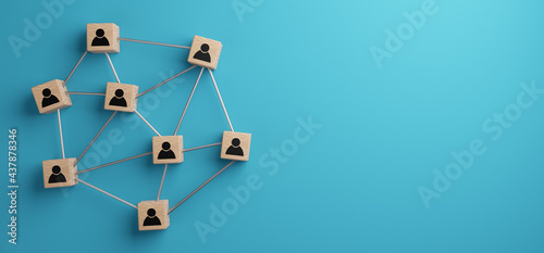 Wooden blocks with people icon on a blue background, 3d illustration, human resources and team management concept. 3D rendering.