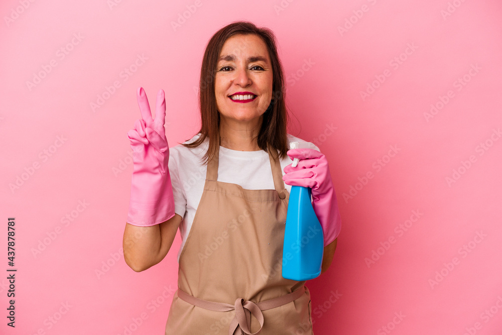 Middle age caucasian woman cleaning home isolated on pink background showing number two with fingers. Middle age caucasian woman cleaning home isolated on pink background showing number two with fingers.