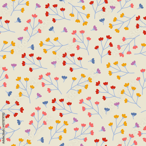 Floral seamless pattern with colorful small flowers on beige background