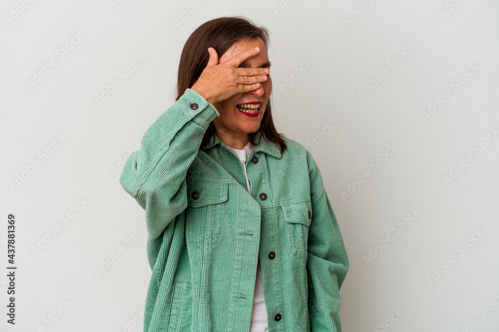 Middle age caucasian woman isolated on white background covers eyes with hands, smiles broadly waiting for a surprise. Middle age caucasian woman isolated on white background covers eyes with hands, smiles broadly waiting for a surprise.