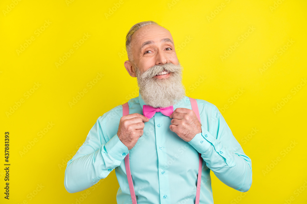 Photo portrait of old man in turquoise shirt bowtie preparing for date smiling happy isolated vibrant yellow color background Photo portrait of old man in turquoise shirt bowtie preparing for date smiling happy isolated vibrant yellow color background