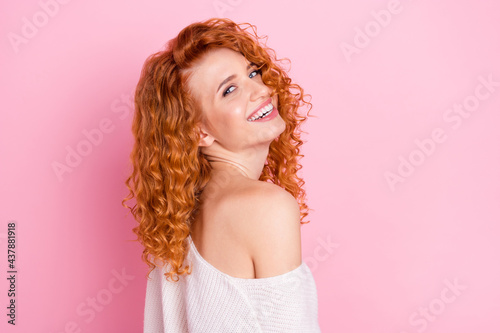 Photo portrait of red haired woman laughing in stylish clothes with off-shoulder isolated on pastel pink color background