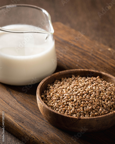 buckwheat and buckwheat milk on a wooden kitchen board, gluten-free.