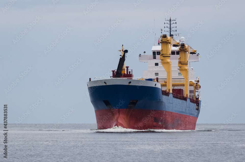 MERCHANT VESSEL - Freighter sails on the sea