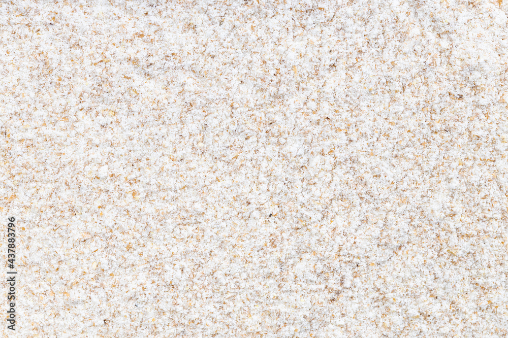 background - uncooked whole-grain wheat flour background - uncooked whole-grain wheat flour