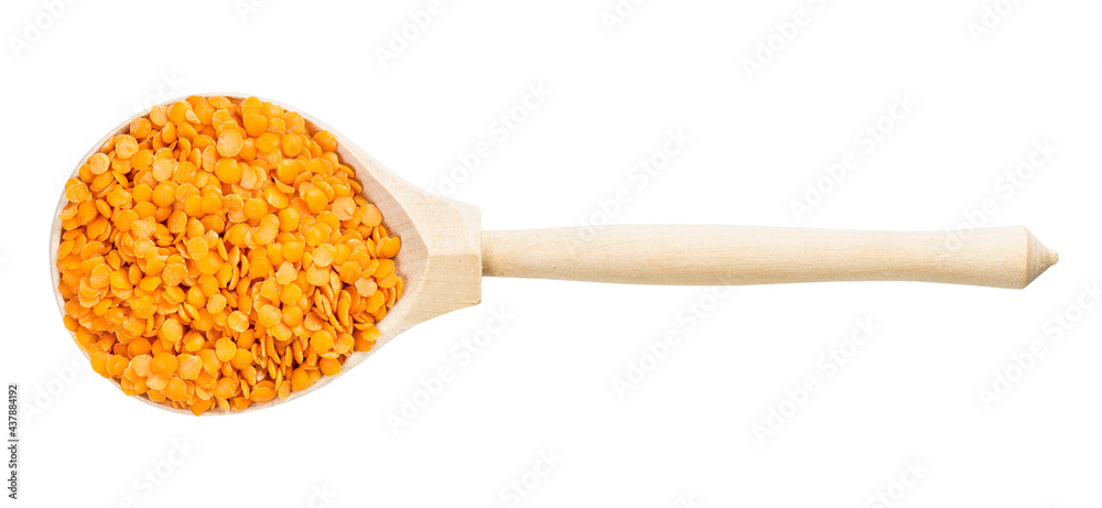 top view of wood spoon with split red lentils top view of wood spoon with split red lentils