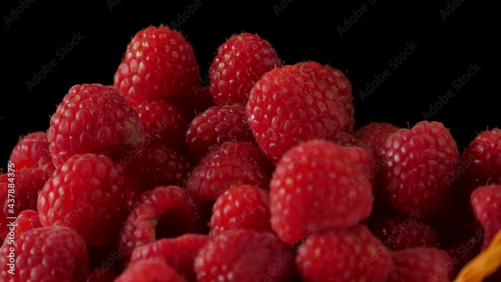 Fresh tasty raspberry in the basket turns on plate Fresh tasty raspberry in the basket turns on plate