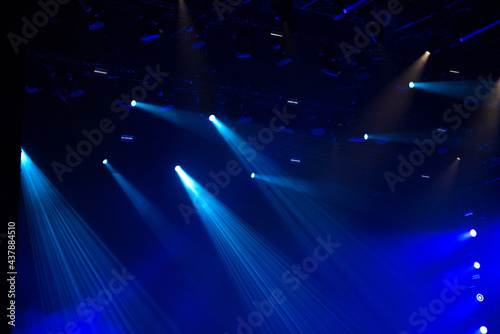 Blue stage lights glowing in the dark